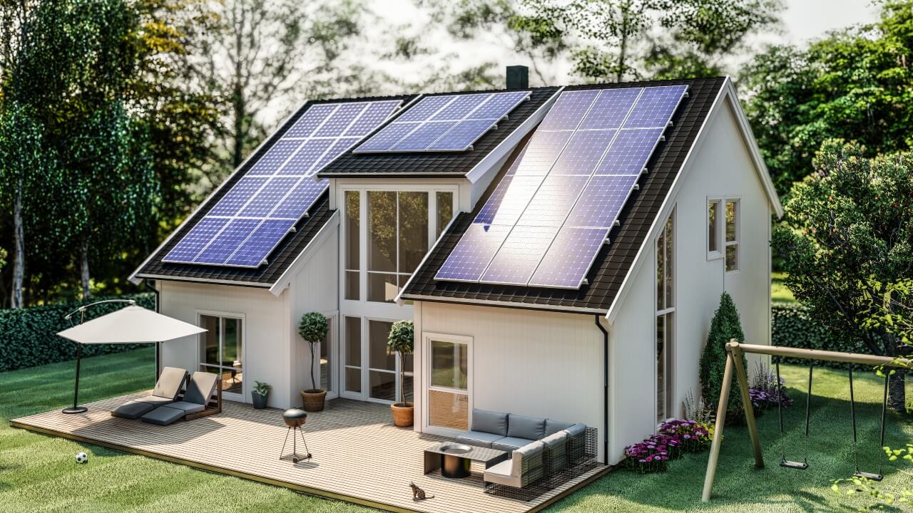 Are solar panels worth it? Solar panels installed on the roof of a modern house with a large garden.